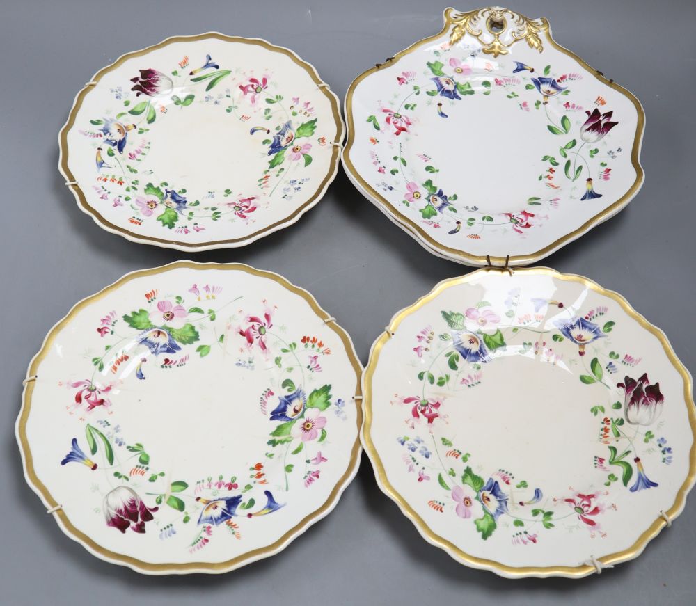 A set of three Staffordshire porcelain plates, gilt and painted with flowers and a matching pair of shaped circular dishes, width 26cm